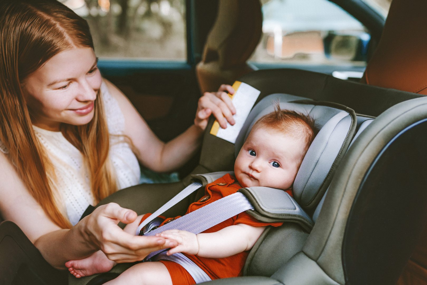 Baby in car seat with mom