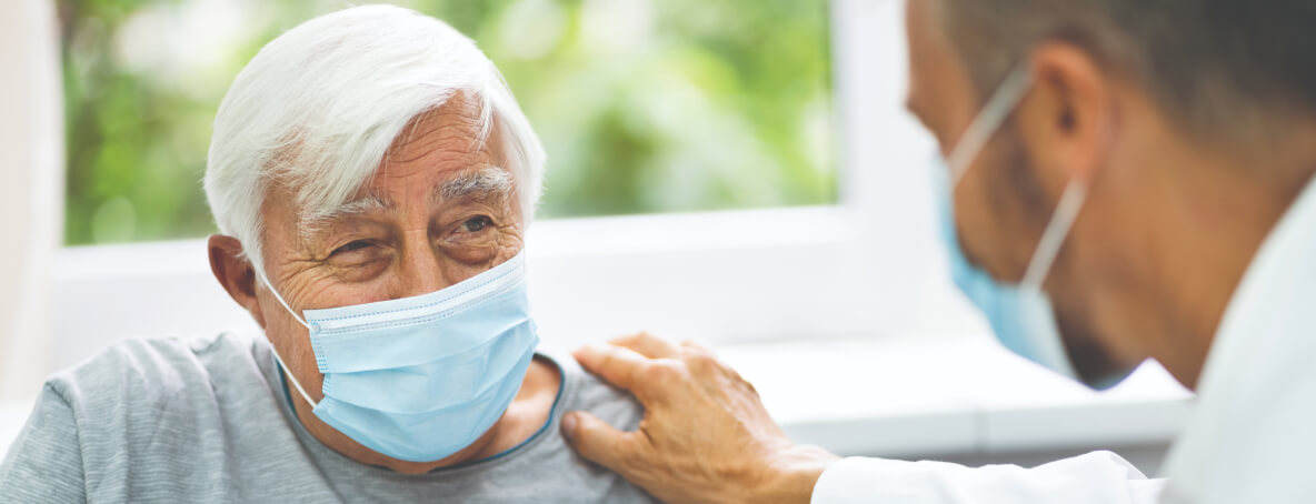 Elderly man with mask at doctor 1