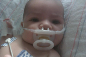 Picture of Brady in the hospital, with oxygen tubes in nose