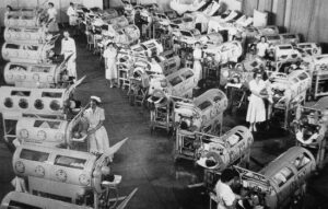 Image of a hospital ward filled with iron lung patients.