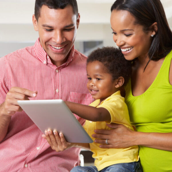 AA-parents-with-young-boy-looking-at-ipad