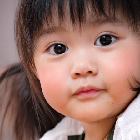 Asian-young-children-with-toys-on-the-table-square